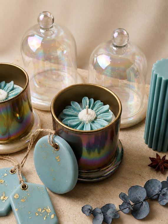 Gulzar — sculpted flower candles in lustre jars with glass cloche domes and gold-flecked wax sachets